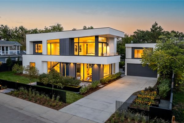 modern house at twilight with lights on